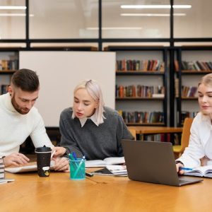three-friends-studying-from-documents-laptop-library_23-2149283306.jpg Advanced Academic Enrichment