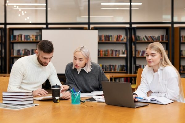 three-friends-studying-from-documents-laptop-library_23-2149283306.jpg Advanced Academic Enrichment